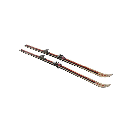 A retro pair of French skis - red and white Rossignol with original bindings. Discoverd in The French Alps