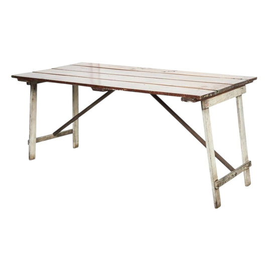 A unique and charming French rustic trestle style table with antique timber door top