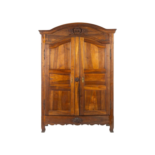 Antique French 19th Century Walnut armoire with beautiful carvings to the facade from Provence.