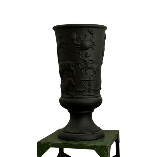 Black concrete vase with horoscope details