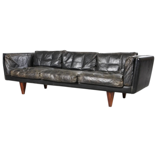 Illum Wikkelsø. Three-person sofa, model V11, black leather. Heavy but great Patina.