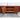 Open cupboard doors showing the internal timber shelving of the Chiswell teak sideboard.