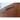 Close view of a sculpted wave handle on the teak Chiswell sideboard.
