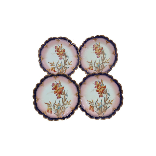 Four hand painted and gilded Limoges dessert plates