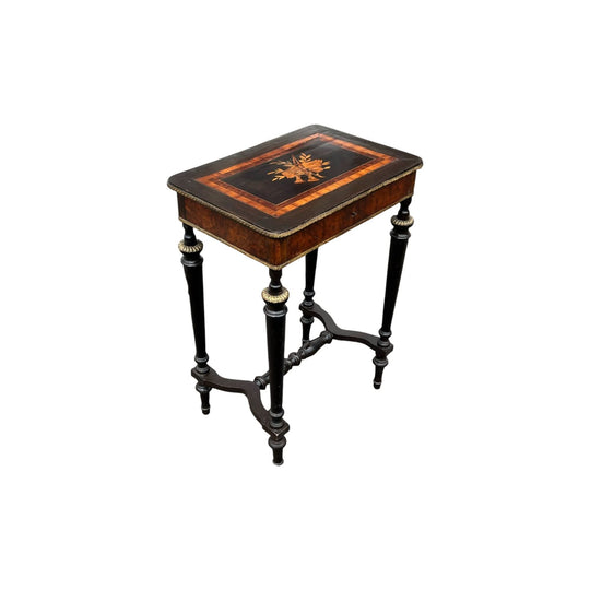 French Ebonized and amboyna venner work table  with musical trophy and ormolu mounts,   c. 1870