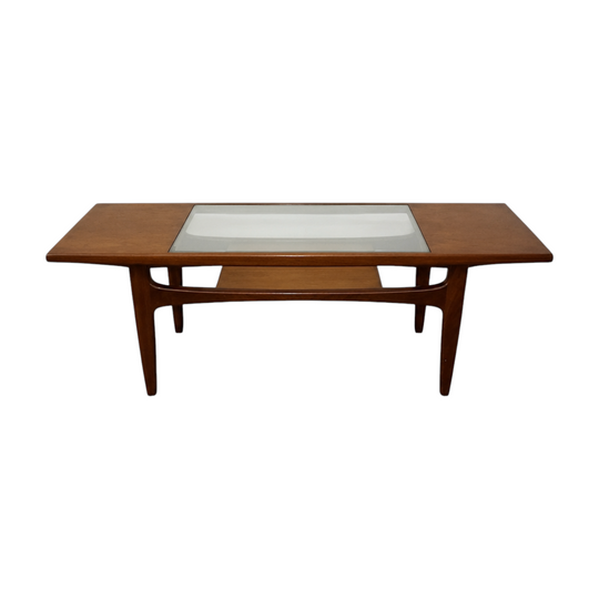 'Long John' Teak Coffee Table - Designed by Victor Wilkins. An exact table/design was Famously featured on the set of 'Mad Men'.  This timeless piece beautifully merges premium British craftsmanship with a sleek Danish-modern aesthetic.