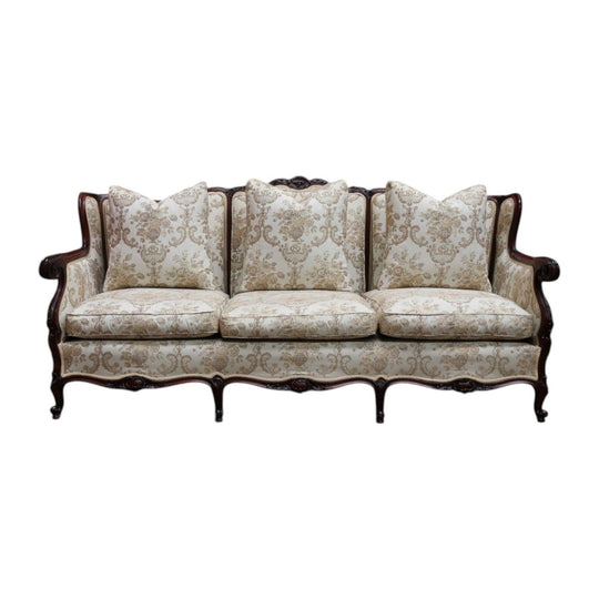Grand Antique Victorian-Style Walnut Sofa with Cream Floral Upholstery and Cushions