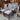 Grey fabric dining chairs with walnut-toned timber frames