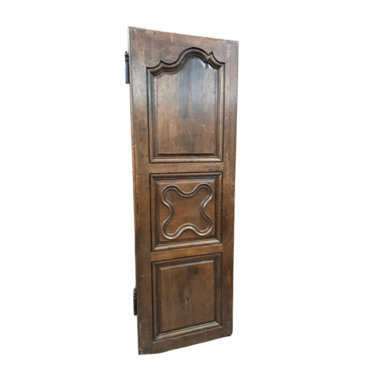A single armoire door with lovely carvings, from the French Alps