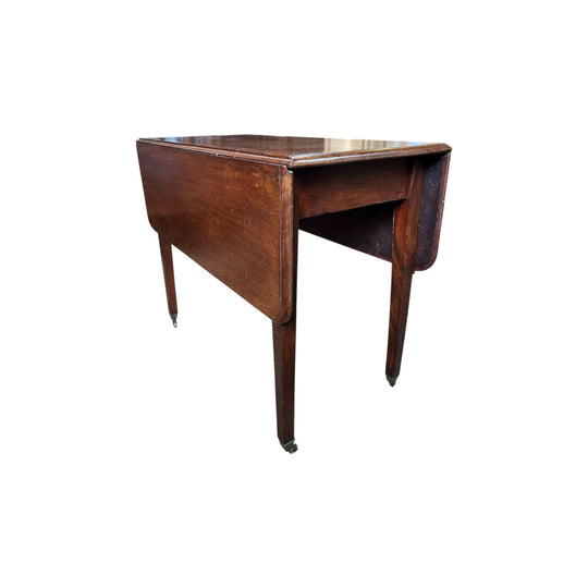 Mahogany dropside table with fine square legs and brass castors, c. 1800