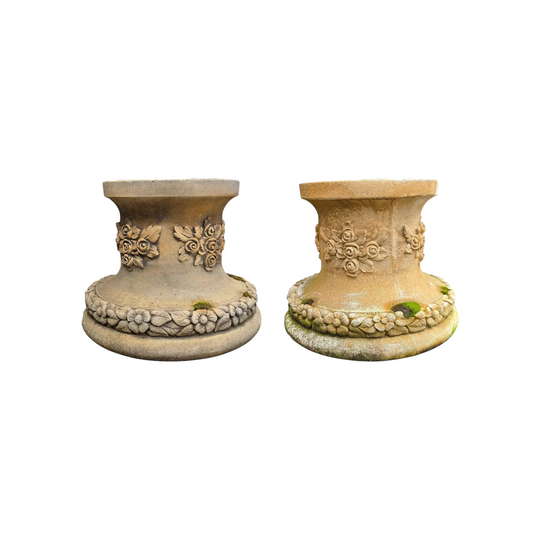 A pair of cast limestone statue or urn garden stands