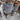 Modern grey dining chairs showing curved upholstered backs