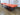 Opposite three-quarter view of the low rosewood coffee table.