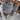 Set of six grey upholstered dining chairs, rear view