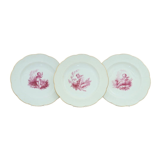 Three cherub decorated plates by Minton