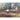 Close detail of painted figures and architectural elements within the European street scene.