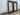 Pair of tall vintage timber frames viewed at an angle, showing broad dark timber profiles.